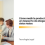 Group of diverse lawyers collaborating around a laptop in a bright office; article title about measuring law firm productivity with real data.